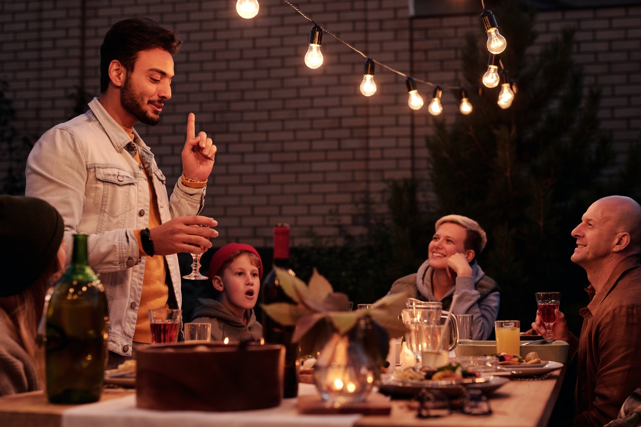 backyard toast beneath lights