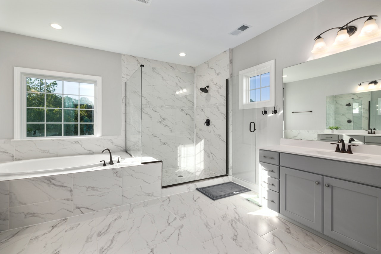 luxury bathroom with lighted mirrows