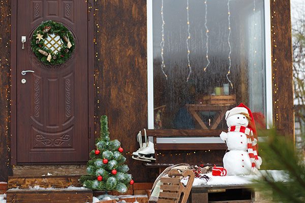 snowman decor in front porch
