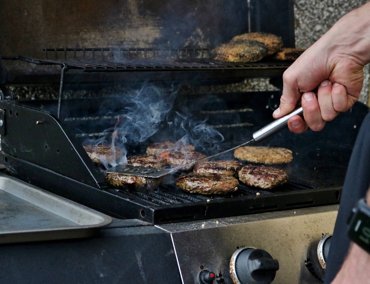 Burger meat cooking in barbecue