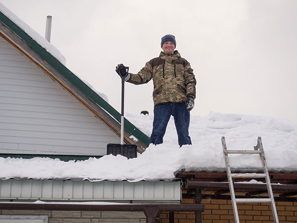 cleaning snow from roof