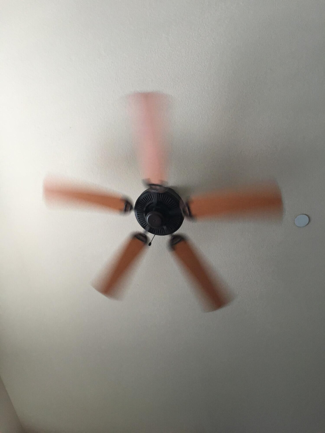 Low angle view of ceiling fan at home