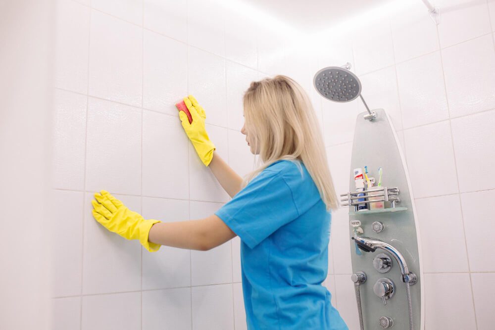 cleaning bathroom wall