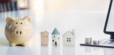 piggy bank and wooden house