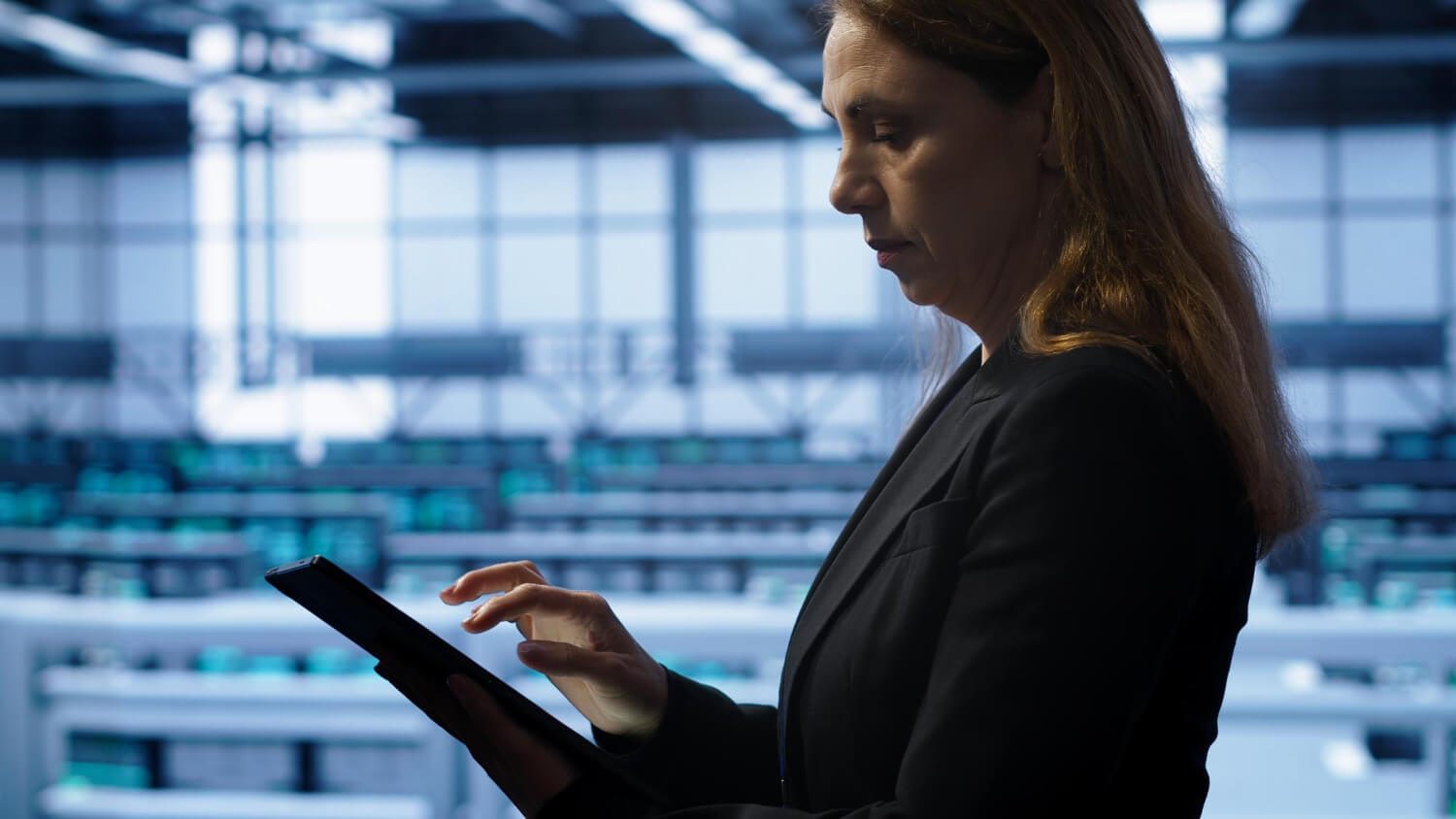 Professionals working together around a computer, utilizing RFP software to streamline accurate proposal creation.